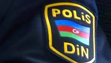 azerbaycanda-polis-emekdasi-heyat-yoldasini-sobede-gulleleyerek-oldurub